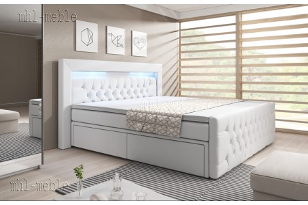 Białe łóżko kontynentalne ARONA z szufladami i zanóżkiem